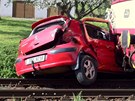 Motorov� vlak peugeota z p�ejezdu odtla�il. Ve vraku auta zahynula