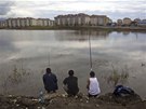 Builders from Yerevan, Akop, Artyom and Kenrikh (L-R) fish in a pond outside... Builders from Yerevan, Akop, Artyom and Kenrikh (L-R) fish in a pond outside...