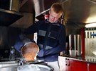 Jay Grey, 21, prepares baked beans inside his roadside double-decker cafe, the... Jay Grey, 21, prepares baked beans inside his roadside double-decker cafe, the...