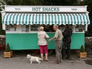 People wait outside a snack van along the A683 near High Casterton, northern... People wait outside a snack van along the A683 near High Casterton, northern...